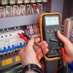 Man Using Volt Tester — Electric Services in Emerald, QLD