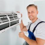 Man Repairing Air Condition — Electric Services in Emerald, QLD